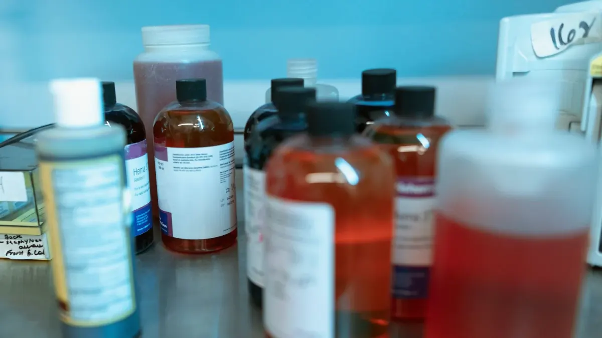 A veterinarian examining a supplement bottle label beside a dog on an exam table