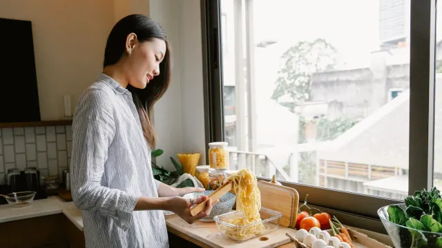 Dog owner preparing a meal