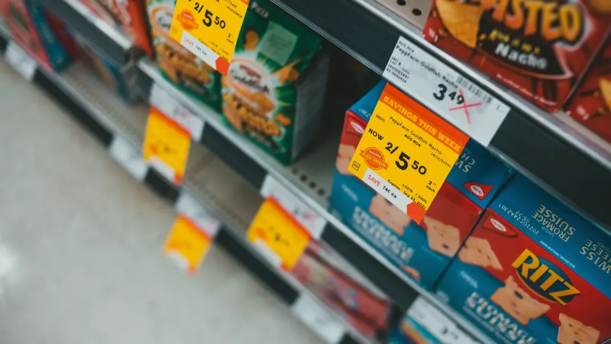 Senior dog owner reading a supplement label in a pet store aisle